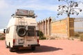 Car standing near gate of sanatorium in Soviet style. Beautiful landscape, Issyk-Kul lake, Kyrgyzstan