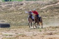 ISSYK KUL, KYRGYZSTAN - JULY 15, 2018: Performance of kyz kuuma girl chasing , equestrian traditional sport at the
