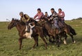 Issyk Kul, Kyrgyzstan - May 28, 2017 - Buzkashi players race towards the goal