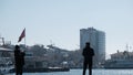 Istanbul bosphorus,sunny day. men are fishing on concrete port in Kadikoy shore and look at the marmara sea and transportation fer