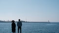 Istanbul bosphorus,sunny day. One man and girls standing on concrete port in Kadikoy Royalty Free Stock Photo