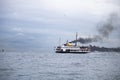 In Istanbul, ferries operate on the Bosphorus line. Traditional old steamers. Cloud weather in the background
