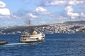 In Istanbul, ferries operate on the Bosphorus line. Traditional old steamers. Cloud weather in the background and the Anatolian