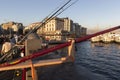 Istanbul Galata Bridge in Karakoy districts in daylight with fishing people walking and city skyline