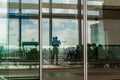 Istanbul International Airport, Turkey; father pointing to the baby on the arriving boeing airplane in a lounge of the new Istanb