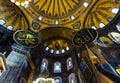 Bottom up interior view of the domed apse in Hagia Sophia with mosaic of Virgin Mary and Child