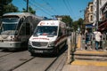 Istanbul, June 15, 2017: Ambulance and urban over ground metro sitting next to each other in the middle of the day