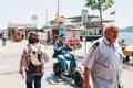 Istanbul, June 17, 2017: A guy or a young man is driving down the city street on an electric scooter or bike. Nearby are Royalty Free Stock Photo