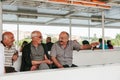 Istanbul, June 17, 2017: Three adult male friends of local people swim by ferry or passenger boat, communicate and laugh