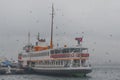 Istanbul, Kadikoy. Foggy morning, waiting to ferry passengers an Royalty Free Stock Photo