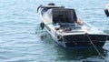 Istanbul kadikoy people fishing on concrete shore and small and old vintage fishing boat on bosporus istanbul near haydarpasa main Royalty Free Stock Photo