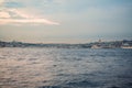 Istanbul at sunset, Turkey. Tourist boat sails on Golden Horn in summer. Beautiful sunny view of Istanbul waterfront