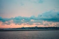 Istanbul at sunset, Turkey. Tourist boat sails on Golden Horn in summer. Beautiful sunny view of Istanbul waterfront