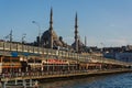 ISTANBUL, TURKEY - APRIL 11, 2014: Galata Bridge over Golden Horn. Fish restaurants and shops on the first floor