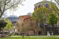 View of Hagia Irene church on the front and dome of Hagia Sophia on the background. Royalty Free Stock Photo