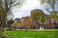 View of Hagia Irene church on the front and dome of Hagia Sophia on the background. Royalty Free Stock Photo