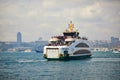 ISTANBUL, TURKEY - APRIL 21, 2023: Passenger ferry sails across the Bosphorus strait in Istanbul, Turkey