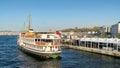 Passengers Loading into local ferry in Eminonu ferry terminal before sunset, Istanbul, Turkey