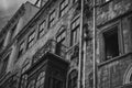 Istanbul, Turkey - April 8, 2012: Turkish man smoking peeping shyly to the window of his house in Istanbul, black and white photo Royalty Free Stock Photo