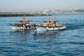 Two boats crossing a harbor