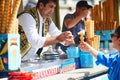 ISTANBUL, TURKEY - APRIL 25, 2023: Vendor serves the ice cream cone on a stick and then take it away when customer tries to grab