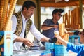 ISTANBUL, TURKEY - APRIL 25, 2023: Vendor serves the ice cream cone on a stick and then take it away when customer tries to grab