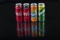 Istanbul, Turkey - August 25, 2020; Aluminum bottles of Fanta, Coca-Cola, Sprite, on a black isolated background