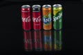 Istanbul, Turkey - August 25, 2020; Aluminum bottles of Fanta, Coca-Cola, Sprite, on a black isolated background