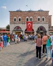 Crowds of pedestrians at Eminonu during the Victory Day holiday with Egyptian Bazaar in the background, Istanbul, Turkey