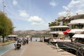 Pedestrians walking by the Bosphorus between Bebek and Hisari districts, and docked boats and yachts, Istanbul, Turkey Royalty Free Stock Photo