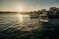 Tourist ship sails on the Golden Horn, scenic sunny beautiful waterfront of Istanbul city at sunset in summer