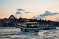 ISTANBUL, TURKEY - AUGUST 21, 2018: view from Galata Bridge overlooking the Golden Horn with ferries and Suleymaniye Mosque Royalty Free Stock Photo
