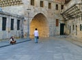 Businessman walking past a beggar woman