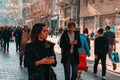 18.12.2019, Istanbul, Turkey. Crowds of people walk through the streets of the capital. Women with mobile phones in the foreground