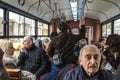 Crowded interior of an istanbul tram, packed with Turkish people, during rush hour on the Asian side