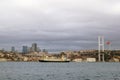 Istanbul, Turkey - December 28, 2022: Impressive Passenger Ship Sailing on the Bosphorus Strait Passing Under the Bridge at Sunset Royalty Free Stock Photo