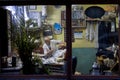 ISTANBUL, TURKEY - DECEMBER 29, 2015: Old barber shaving one of his client at night, in an old fashionned barber shop on the Europ