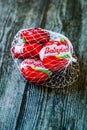 Istanbul, Turkey - February 23, 2018: Mini Babybel Cheese in Red Wax on Wooden Surface