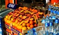 ISTANBUL, TURKEY - FEBRUARY 24. 2009: Store selling fresh fruits pomegranates, oranges, apples and bananas and plastic bottles