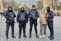 A young woman is photographed with police officers at Sultanahmet Meydani in Istanbul, Turkey. Royalty Free Stock Photo