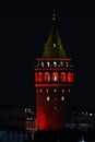 4-09-2025 Istanbul Turkey: Galata Tower illuminated with red lights at night in Beyoglu district Royalty Free Stock Photo