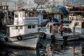 Small Wooden Fishing Boats Anchored at Pier Royalty Free Stock Photo