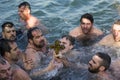 Istanbul, Turkey - January 6, 2018. A man retrieves a wooden cross during an Epiphany ceremony to bless the water. This ceremony m