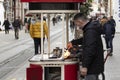 Street seller of roasted chestnuts on Istiklal Avenue