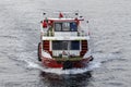 Tourists sail on a small ship across the Bosphorus