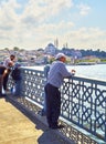 Citizens on the Galata bridge. Istanbul, Turkey.