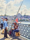 Citizens fishing on the Galata bridge. Istanbul, Turkey. Royalty Free Stock Photo
