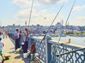 Citizens fishing on the Galata bridge. Istanbul, Turkey. Royalty Free Stock Photo