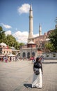 ISTANBUL, TURKEY - JULY 07: Muslim woman in front of Hagia Sophia Mosque on July 07, 2014, in Istanbul, Turkey