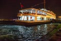 ISTANBUL, TURKEY - JULY 05, 2018: Night view of the old cruise vessel Emin Kul built in 1989 on the Eminonu pier in the Golden Royalty Free Stock Photo